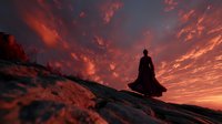 Silhouette of person in flowing cape standing on rocky cliff against dramatic orange and red sunset sky. Contemplative figure gazing at horizon.