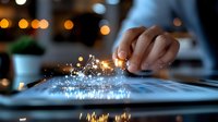 Digital tablet screen emitting magical light sparkles as finger touches surface, creating ethereal glow effect against dark background with bokeh lights.