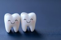 Cute smiling teeth characters on dark background, dental care concept for children dentistry, oral hygiene promotion and healthcare education materials.