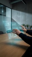 Businesswoman in dark suit interacting with holographic financial data displays showing charts and graphs in modern office environment with glass partitions and wooden desk.