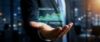 Businessman holding holographic sustainability metrics display with green growth chart and efficiency score data against urban skyline background.