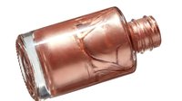 Copper metallic essential oil bottle with dropper cap isolated on white background for cosmetic, skincare, and wellness product packaging design.