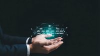 Businessman holding glowing digital data network hologram in cupped hands against dark background for technology and innovation concepts.