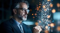 Mature Caucasian businessman with glasses and gray hair examining glowing digital network visualization with orange bokeh lights in dark office setting.