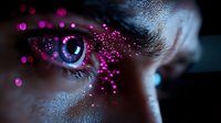 Mesmerizing close-up of eye with pink glitter makeup and bokeh effects creating magical sparkles around blue iris in dark atmospheric lighting.