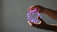 Hands holding glowing purple digital sphere with connected network nodes and light particles, representing technology, innovation, data connectivity, and future digital transformation concepts.