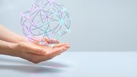 Abstract geometric brain network floating above open palm representing artificial intelligence and digital innovation in healthcare technology.