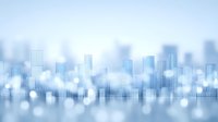Blurred modern city skyline silhouette against soft blue background with bokeh light effects creating dreamy urban landscape atmosphere.