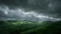 Dramatic stormy sky with dark clouds over lush green rolling hills and valleys. Moody atmospheric landscape with threatening weather conditions.