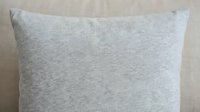 Gray linen pillow with soft texture, isolated on neutral background. Suitable for home decor, interior design, and bedding product mockups.