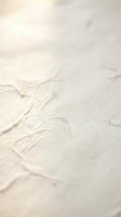 Soft beige marble texture with natural veining patterns and warm lighting for luxury interior design backgrounds.