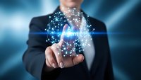 Professional businessman holding glowing cloud computing network with connected data points and digital particles in modern technology concept.