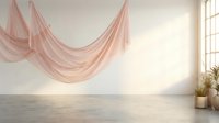 Elegant pink fabric draping gracefully in minimalist interior with natural sunlight streaming through window creating soft shadows on concrete floor.
