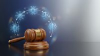Wooden judge gavel with glowing digital zodiac signs circle on dark background representing astrology law and cosmic justice concepts for legal services.