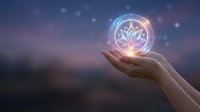 Glowing lotus mandala symbol floating above open palm against dreamy bokeh background for meditation wellness and spiritual energy concepts.