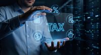 Businessman managing digital tax interface with holographic financial icons and data analytics in modern technology environment for accounting solutions.