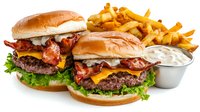 Bacon cheeseburgers with fresh lettuce on toasted buns served alongside golden french fries and creamy dipping sauce on white background, restaurant menu photography.