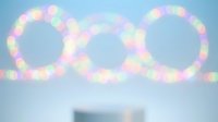 Colorful bokeh lights forming infinity symbol against soft blue background for celebration, party decoration, wedding, anniversary concepts.