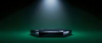 Black hexagonal podium stage with dramatic spotlight illumination on dark green gradient background for product display and presentation purposes.