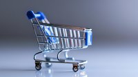 Empty shopping cart on gray background with soft blue lighting effect, metallic miniature trolley symbolizing retail, commerce, and online shopping concepts.