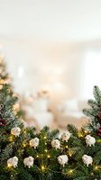 Festive evergreen garland decorated with white ornaments, gold lights, and red berries arranged on blurred holiday background, perfect for seasonal greeting cards and festive designs.