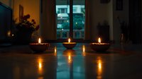 Glowing candles in dark ceramic bowls create warm ambiance on wooden table, with window and city lights visible in background, perfect for meditation or spa atmosphere.