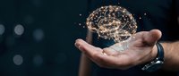 Businessman holding glowing digital brain network in palm, representing artificial intelligence, innovation, and technology solutions for business growth and digital transformation.