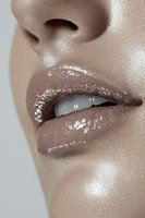 Close-up of glossy brown lips with sparkles and highlighted skin showing partial nose and teeth, suitable for beauty and cosmetic advertising campaigns.