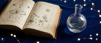 Ancient alchemy book with mystical symbols and glass potion bottle on dark blue background with golden lights for magical fantasy designs.