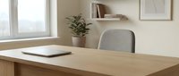 Modern minimalist home office workspace with wooden desk, gray chair, laptop and plant in bright natural light interior for remote work productivity.