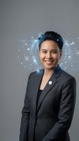 Professional Asian businesswoman in dark suit smiling with digital security network icons and data connections floating around her head on gray background.