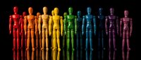 Colorful wooden artist mannequins arranged in rainbow spectrum from red to purple on black background for creative design and art projects.