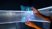 Futuristic holographic interface with glowing data visualization held by hands in modern digital environment for technology presentations.