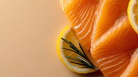 Fresh salmon fillet slices with lemon garnish and microgreens on neutral background, suitable for food photography, culinary blogs, restaurant menus, and healthy eating content.