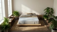 Modern minimalist bedroom interior with platform bed, natural sunlight, and lush green plants creating serene sleeping space for home decor inspiration.