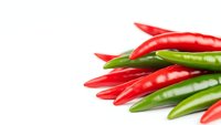 Fresh red and green chili peppers arranged on white background, spicy hot peppers for cooking, culinary ingredients, healthy organic vegetables.