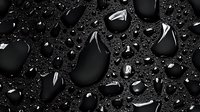 Black water drops on dark surface with dramatic lighting and reflections creating luxurious minimalist composition with high contrast and glossy effect.