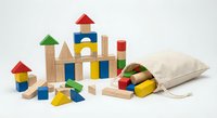 Colorful wooden building blocks set with geometric shapes in canvas storage bag on white background. Educational toy for children development and creativity.