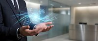 Professional businessman in dark suit holding glowing digital network connections and data visualization in modern office environment for technology presentations.