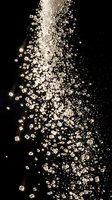 Cascade of sparkling diamonds and gemstones flowing downward against black background, creating luxurious light effects. Suitable for jewelry, luxury goods, wealth, and premium product marketing.