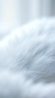 Soft white fur texture with gentle motion blur creating abstract flowing patterns, suitable for backgrounds, design elements, and creative projects.
