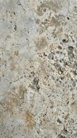 Weathered concrete surface with cracks, stains, and aged texture showing wear patterns, suitable for backgrounds, overlays, and industrial design projects.