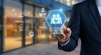 Professional businessman touching digital customer service interface with hexagonal icons representing support, empathy and connection in modern office.