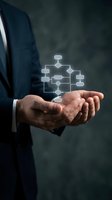 Businessman hands holding glowing flowchart diagram showing business process workflow and organizational structure for corporate planning and management.