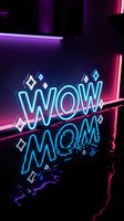 Neon sign displaying wow mom text with sparkle elements in vibrant blue and pink lighting against dark background for modern interior design and celebration.