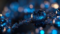 Water drops with blue bokeh lights on dark background create magical atmosphere for nature and abstract photography, macro close up with selective focus.