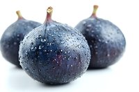 Fresh ripe figs with water droplets on white background. Organic purple fruit for healthy eating, cooking and food photography projects.