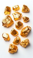 Raw gold nuggets and pieces scattered on white background, showing natural mineral texture and metallic luster. Isolated objects for luxury design projects.