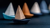 Minimalist sailboats with geometric pyramid sails in muted colors on dark background create serene nautical composition for modern wall decor and design projects.