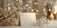 Elegant blank greeting card with dried baby's breath flowers and warm bokeh lights creating cozy winter holiday atmosphere for seasonal celebrations.
